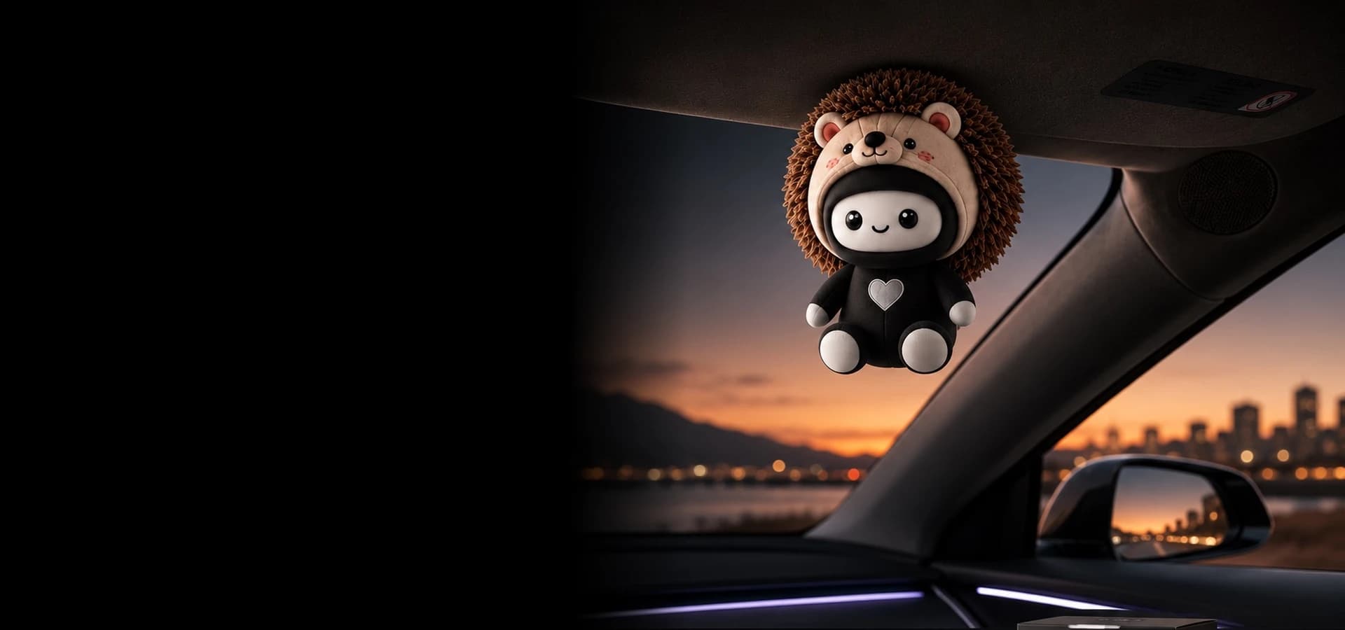 NINMO magnetic plush companion attached to a Tesla sun visor